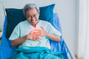 Pain and heartburn old senior asian grandfather in patient unifo